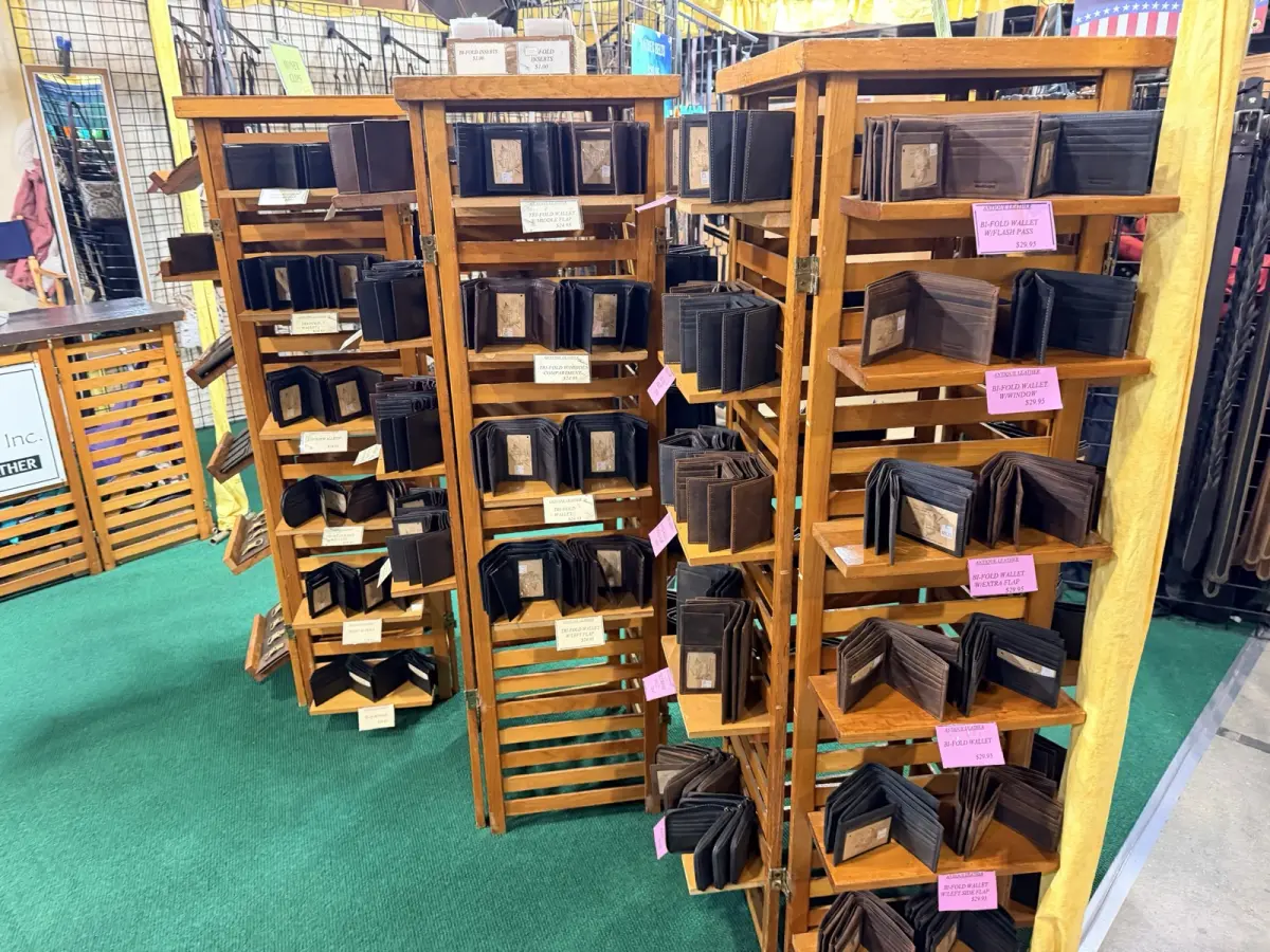 Wooden racks of men's leather wallets