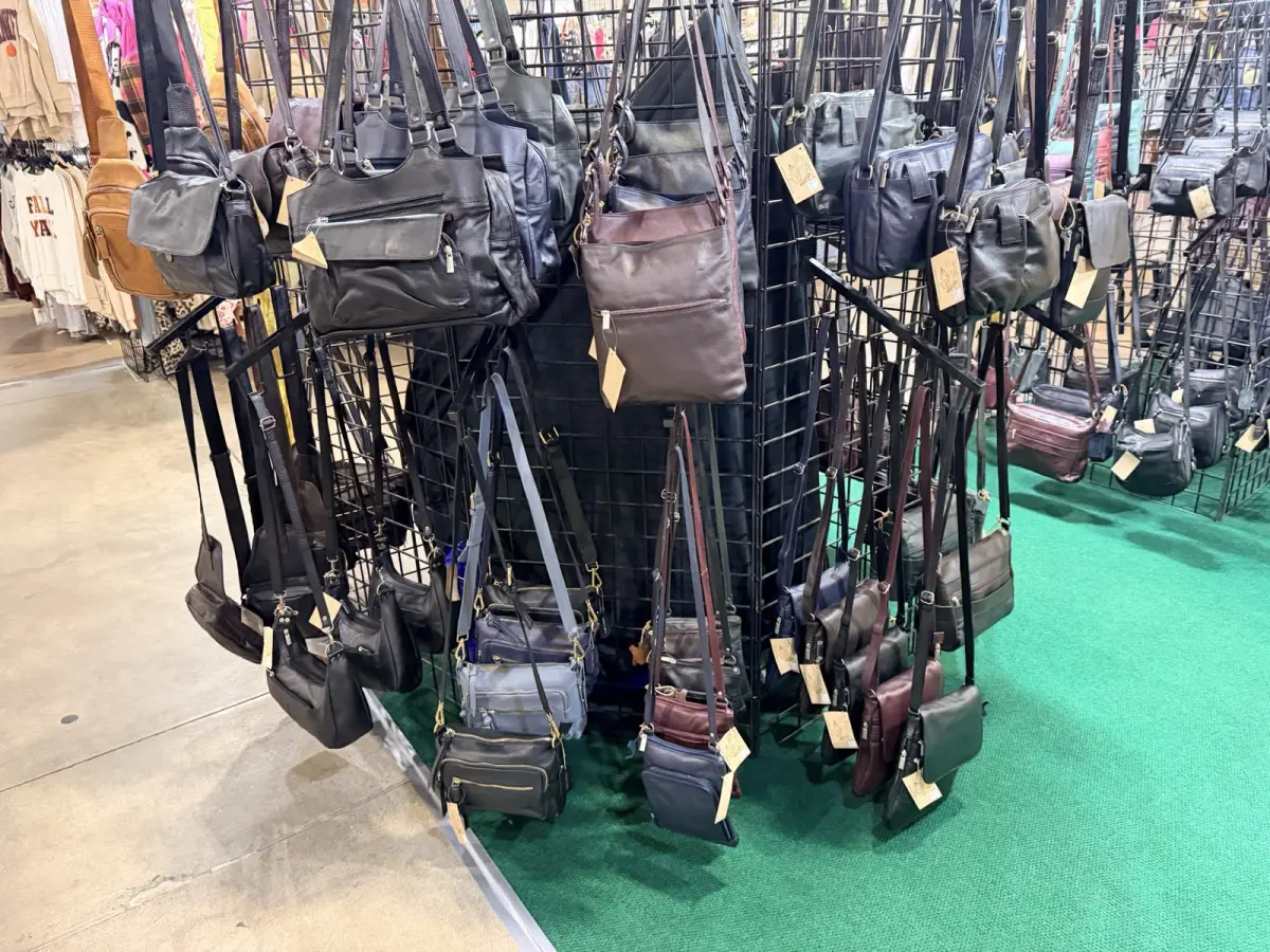 Wall of leather crossbody purses