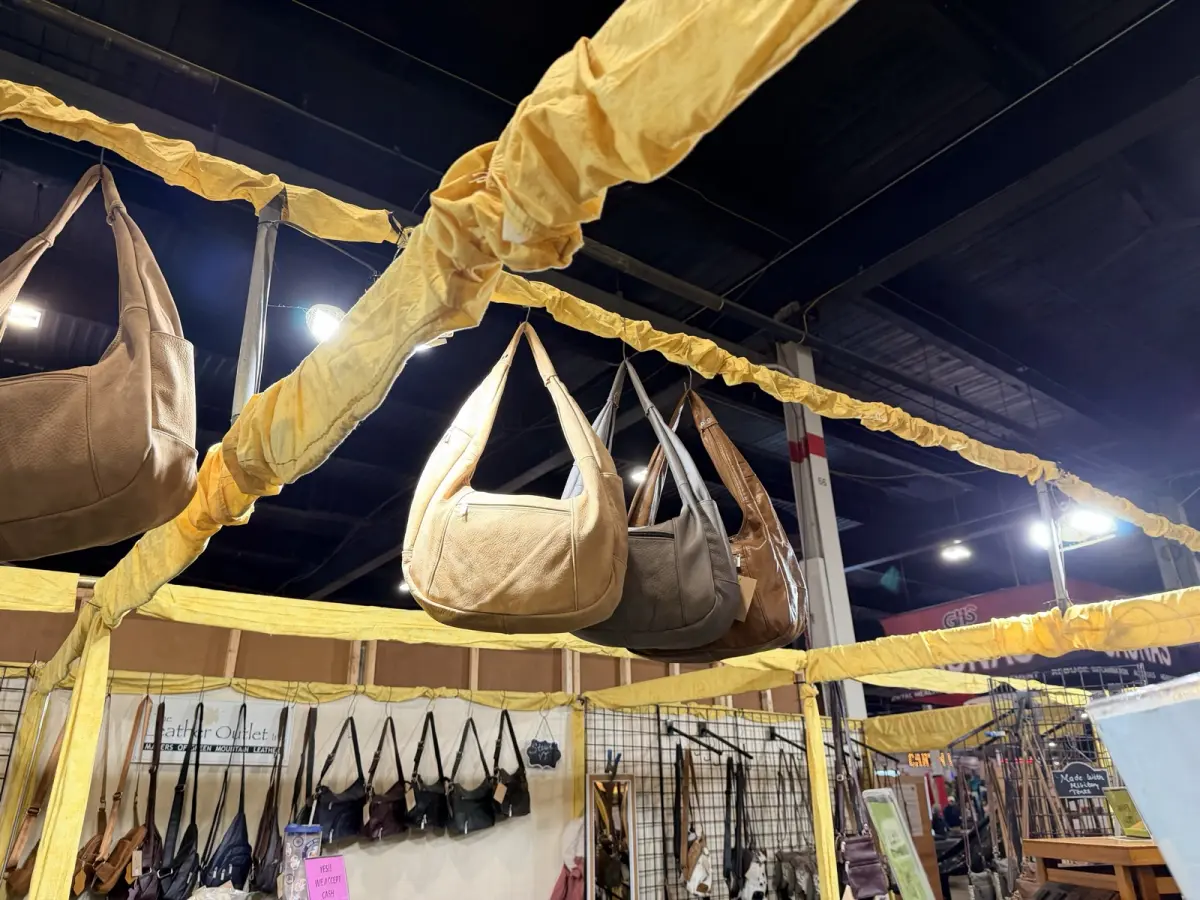 Leather hobo bags hanging overhead