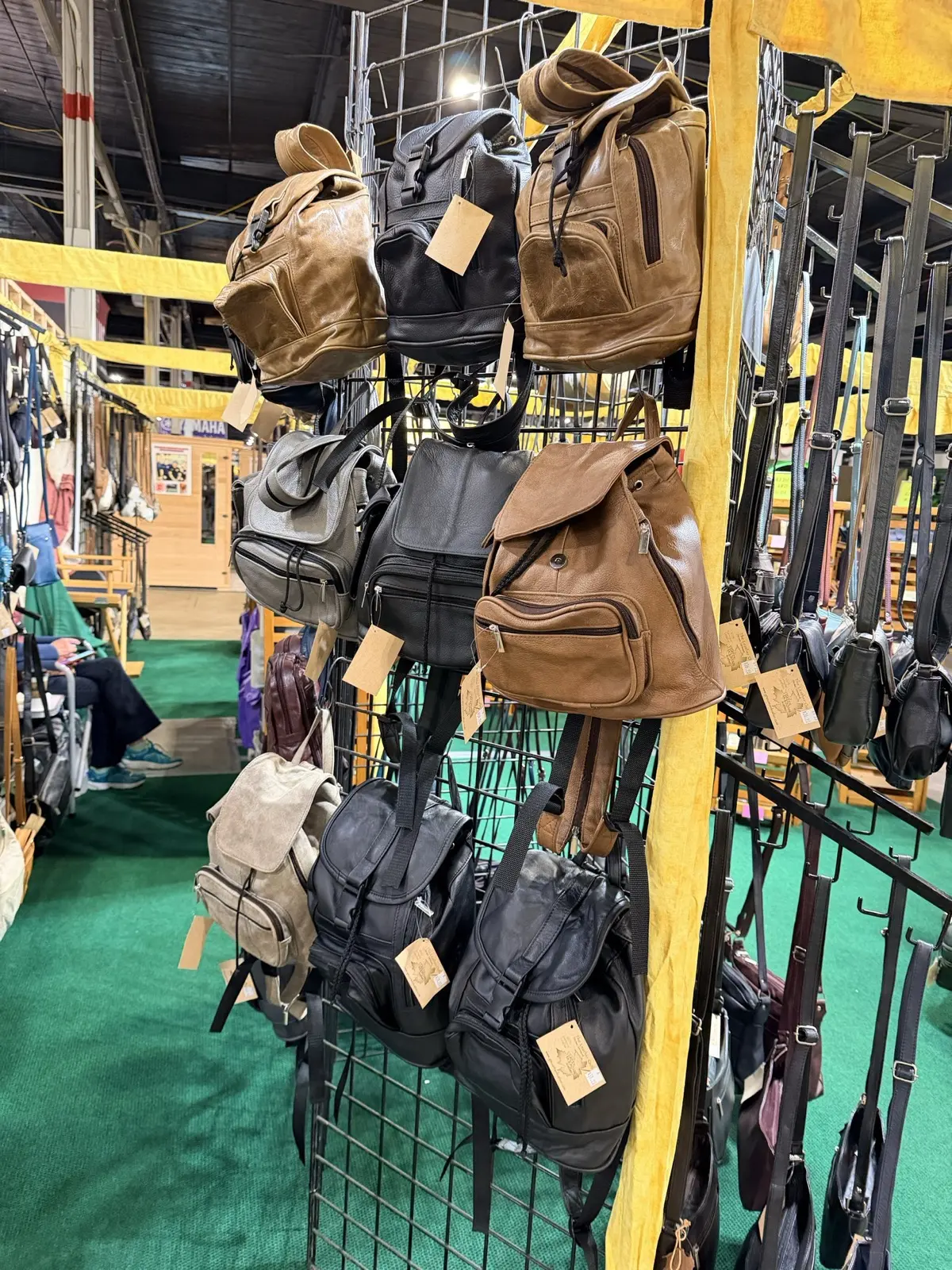 Leather backpacks on the grid wall
